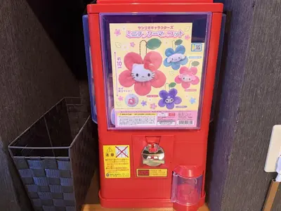 a red toy vending machine with a glass at Yama Hotel Tsukiji in Tokyo