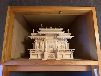 a model of a building in a wooden box at Yama Hotel Tsukiji in Tokyo