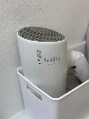 a mortar and pestle sitting in a white holder at Joyful inn in Tokyo