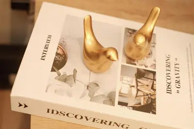 a book on a table with gold vases on it at 100sqm 4BDR New House! 6 minutes from Skytree by train in Tokyo