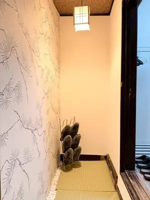 a corner of a room with a wall with drawings of plants at 2BR Tokyo House easy Access to Asakusa 8ppl in Tokyo