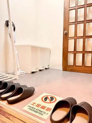 a pair of shoes on a floor next to a door at 2BR Tokyo House easy Access to Asakusa 8ppl in Tokyo