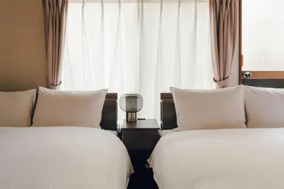 a hotel room with two beds and a window at 2BR Tokyo House easy Access to Asakusa 8ppl in Tokyo