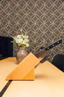 a knife sitting on top of a wooden table at 2BR Tokyo House easy Access to Asakusa 8ppl in Tokyo