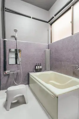 a bathroom with a tub and a toilet and a sink at 2BR Tokyo House easy Access to Asakusa 8ppl in Tokyo