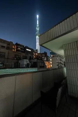 a view of the eiffel tower at night from a balcony at The Sky View Oshiage,Tokyo in Tokyo