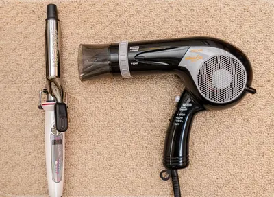 a hair dryer and a hairbrush on the carpet at The Sky View Oshiage,Tokyo in Tokyo