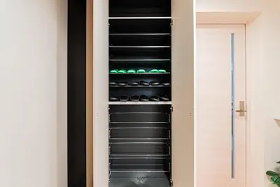 a walk in wine cellar with black shelves at The Sky View Oshiage,Tokyo in Tokyo