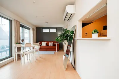 a living room with a couch and a table at The Sky View Oshiage,Tokyo in Tokyo