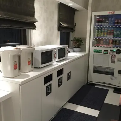 a kitchen with two microwaves on top of a counter at Tokyo Ariake Bay Hotel in Tokyo