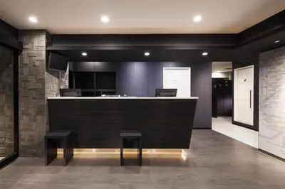 a lobby with a bar with two stools at Tokyo Ariake Bay Hotel in Tokyo