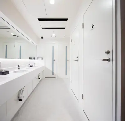 a white bathroom with two sinks and a shower at Tokyo Ariake Bay Hotel in Tokyo