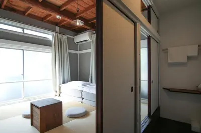 a small room with a bed and a window at hanare in Tokyo