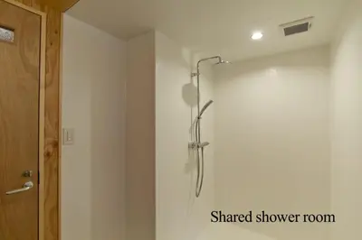 a shower with a shower head in a bathroom at hanare in Tokyo