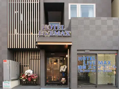 a hotel emergency sign on the front of a building at HOTEL LiVEMAX Asakusa Sky Front in Tokyo