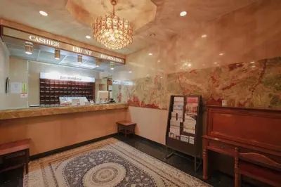 a restaurant with a cashier and a counter in a room at Hotel Suntargas Ueno in Tokyo