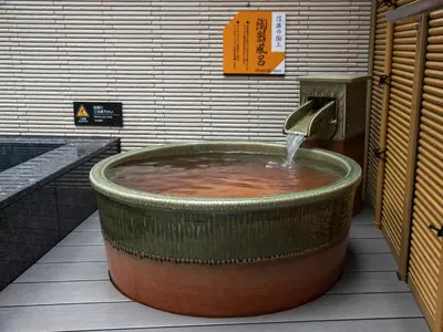 a large water fountain in a building at APA Hotel Sugamo Ekimae in Tokyo