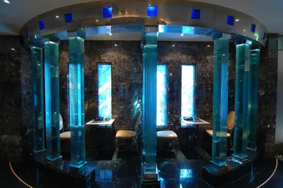 a lobby with blue columns and chairs in a room at HOTEL & SPA J-MEX Shinjuku Kabukicho (Adult Only) in Tokyo