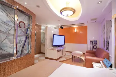 a hotel room with a bed and a television at HOTEL & SPA J-MEX Shinjuku Kabukicho (Adult Only) in Tokyo