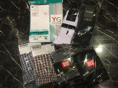 a bunch of products sitting on a table at Capsule Land Yushima (Male Only) in Tokyo