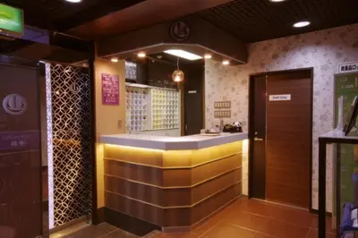 a bar in a restaurant with a counter in a room at Capsule Land Yushima (Male Only) in Tokyo