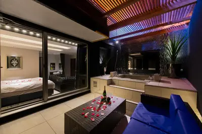 a bedroom with a bed and a table in a room at Hotel Moana Shinjuku (Adult Only) in Tokyo