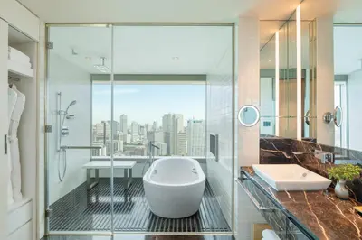 a bathroom with a tub and a view of the city at The Prince Gallery Tokyo Kioicho, a Luxury Collection Hotel in Tokyo