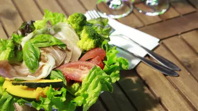 a salad with meat and vegetables on a table at HOTEL THE HOTEL SHINJUKU (Adult Only) in Tokyo