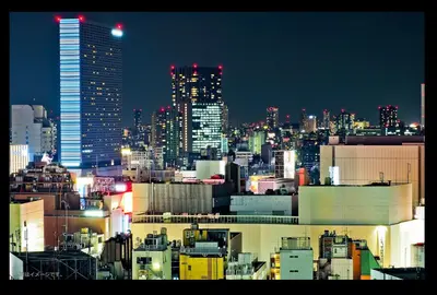 a city skyline at night with tall buildings at HOTEL THE HOTEL SHINJUKU (Adult Only) in Tokyo