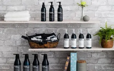 a bunch of bottles of wine sitting on shelves at HOTEL THE HOTEL SHINJUKU (Adult Only) in Tokyo