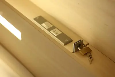 a close up of a door with a pair of scissors at UNPLAN Kagurazaka in Tokyo