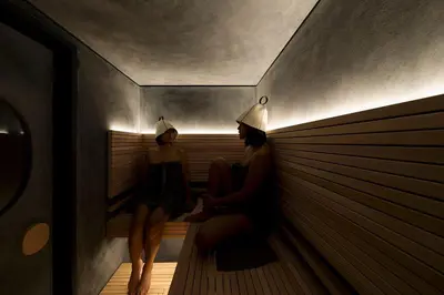 two women in hats sitting in a sauna at UNPLAN Kagurazaka in Tokyo