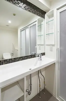 a bathroom with a sink and a mirror at Shinjuku City Hotel N.U.T.S Tokyo in Tokyo