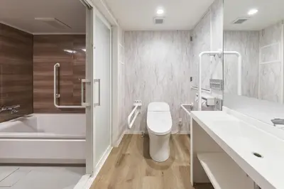a bathroom with a toilet and a tub and a sink at Shinjuku City Hotel N.U.T.S Tokyo in Tokyo