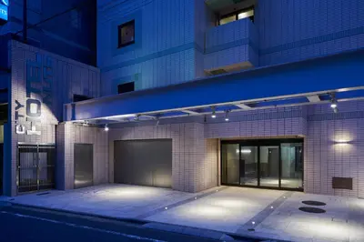 a facade of a building at night at Shinjuku City Hotel N.U.T.S Tokyo in Tokyo