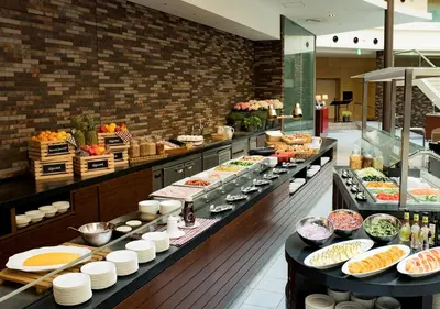 a buffet line with many different types of food at MAIHAMA VIEW HOTEL by HULIC Formerly Tokyo Bay Maihama Hotel in Urayasu