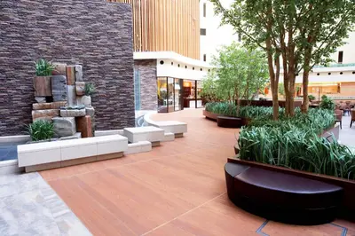 a courtyard with benches and trees in a building at MAIHAMA VIEW HOTEL by HULIC Formerly Tokyo Bay Maihama Hotel in Urayasu