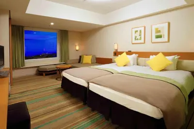 a hotel room with two beds and a large window at MAIHAMA VIEW HOTEL by HULIC Formerly Tokyo Bay Maihama Hotel in Urayasu