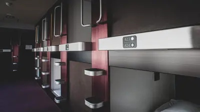 a row of bunk beds in a room at NADESHIKO HOTEL TOKYO Shibuya by unito Female-only in Tokyo