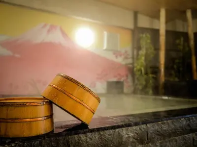 a wooden bucket sitting on top of a table at NADESHIKO HOTEL TOKYO Shibuya by unito Female-only in Tokyo