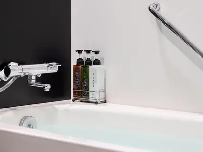 a bathroom sink with a faucet and a mirror at Mitsui Garden Hotel Kyobashi - Tokyo Station in Tokyo