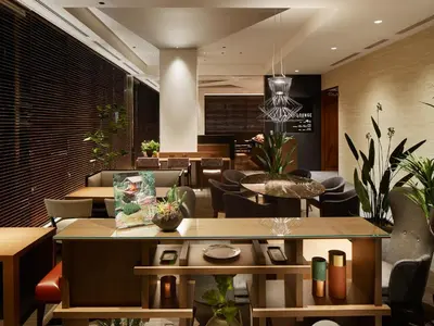 a restaurant with tables and chairs and a dining room at Mitsui Garden Hotel Kyobashi - Tokyo Station in Tokyo