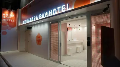 a store front with a sign for a bathroom at Akihabara Bay Hotel (Female Only) in Tokyo