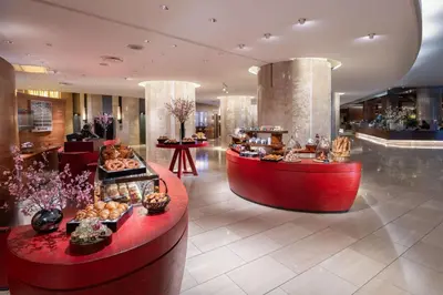 a hotel lobby with aasteryasteryasteryasteryasteryasteryasteryasteryasteryasteryastery at Hilton Tokyo Hotel in Tokyo