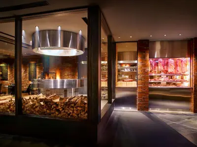 a restaurant with a display window with a pile of wood at Hilton Tokyo Hotel in Tokyo