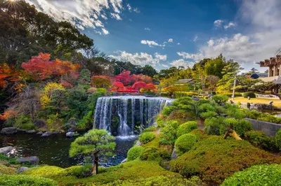 a waterfall in the middle of a garden at Hotel New Otani Tokyo The Main in Tokyo
