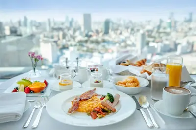 a table with plates of breakfast food and drinks at The Strings by InterContinental, Tokyo by IHG in Tokyo