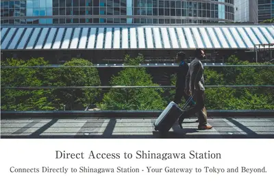 two people walking down a street with their luggage at The Strings by InterContinental, Tokyo by IHG in Tokyo