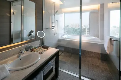 a bathroom with a sink and a shower at The Strings by InterContinental, Tokyo by IHG in Tokyo