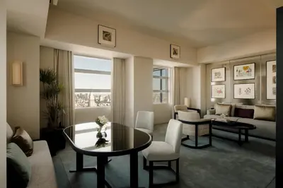 a living room with a table and a couch at Park Hyatt Tokyo in Tokyo